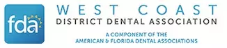The image displays a logo with text, which includes the name West Coast District Dental Association, a website address, and a phone number. The logo features a stylized representation of a dental implant, along with other design elements.