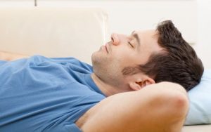 Man from New Port Richey sleeps with an oral appliance to stop snoring as part of his sleep apnea treatment.