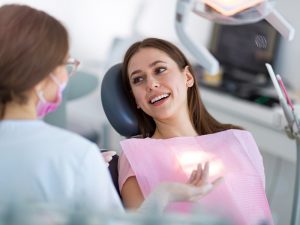 New Port Richey FL laser dentistry patient has the intricacies of dental lasers explained to her in Trinity.